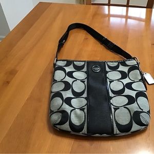 Coach signature canvas crossbody handbag with adjustable strap